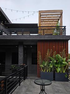 a patio with a table and a building at Locale District Boutique Hotel in Quezon