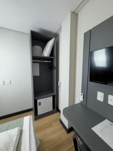 a room with a bed and a tv and a table at Nature Bonito Hotel in Bonito +68 photos