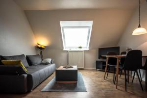 a living room with a couch and a table at Deichkoje 4 Dagebüll in Dagebüll +16 photos