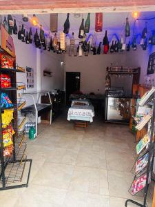a room with a room with a table in it at EBORA Afro Cultural in Ilhéus