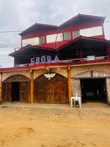 a building with a sign on top of it at EBORA Afro Cultural in Ilhéus