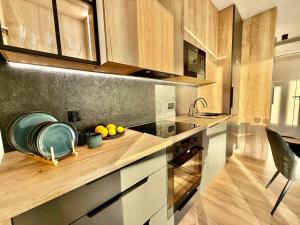Kuchyň nebo kuchyňský kout v ubytování EASY RENT- Szeligowskiego 211 Chodźki Residence, 24h Check-in