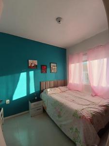 En eller flere senge i et værelse på Casa Cassino com Piscina