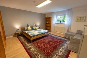 Ένα ή περισσότερα κρεβάτια σε δωμάτιο στο Taunuslodge