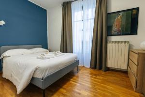 Postel nebo postele na pokoji v ubytování Casa Stella Charme nel Quadrilatero Romano