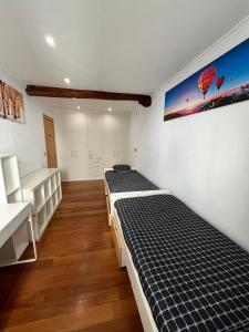 Ένα ή περισσότερα κρεβάτια σε δωμάτιο στο APARTAMENTOs URDAIBAI 6