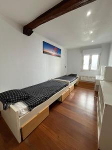 Ένα ή περισσότερα κρεβάτια σε δωμάτιο στο APARTAMENTOs URDAIBAI 6 +17 φωτογραφίες