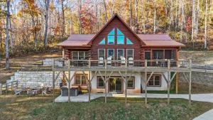 a house with a large deck on top of it at Sunshine Hill in Fairview
