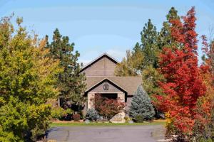 a church with autumn trees in front of it at Running Y Ranch Golf & Spa Resort in Klamath Falls