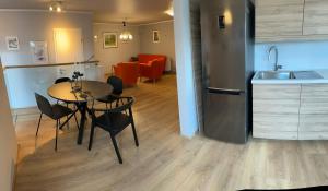 a kitchen and dining room with a table and chairs at Two rooms apartment in Reykjavik in Reykjavík +1 photo