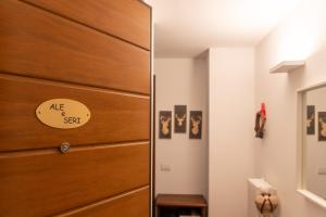 a wooden door in a room with a drawer at Monolocale in centro a Madesimo in Madesimo +1 photo
