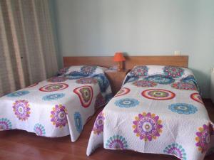 A bed or beds in a room at Apartamento Prado