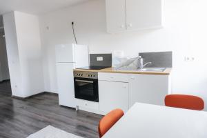 Η κουζίνα ή μικρή κουζίνα στο Ferienwohnung Zur Wieskapelle W4 - ideal für Monteure