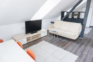 Μια τηλεόραση ή/και κέντρο ψυχαγωγίας στο Ferienwohnung Zur Wieskapelle W4 - ideal für Monteure