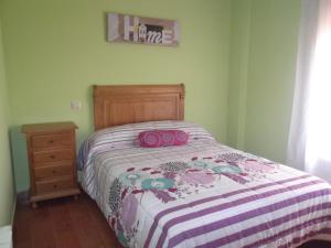 A bed or beds in a room at Apartamento Prado