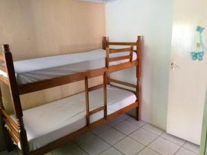 a couple of bunk beds in a room at next to UNISC in Santa Cruz do Sul