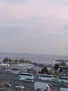 a parking lot with buses and cars on a highway at Simge Suite Hotel in Istanbul