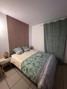 a small bedroom with a bed and a window at Clos d'AIX studio 11 in Aix-en-Provence