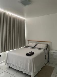 Ένα ή περισσότερα κρεβάτια σε δωμάτιο στο Apto excelente localização Belem Cop 30