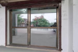 an open glass door with a view at SPOT ON New Phulpur Restaurant And Hotel in Phūlpur +18 photos