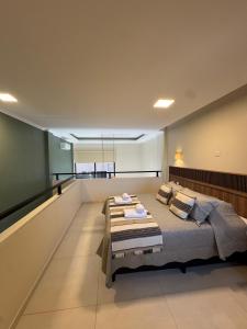 a bedroom with a large bed in a room at Iguazu Lofts in Puerto Iguazú