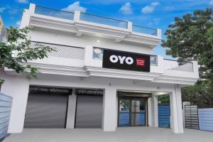 an office building with an ovo sign on it at SPOT ON New Phulpur Restaurant And Hotel in Phūlpur