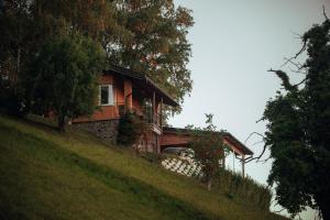 a house on the side of a hill at SkyView Dežno in Makole