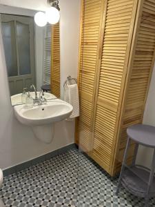 a bathroom with a sink and a toilet and a stool at Nostalgia in Turda +62 photos