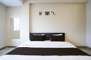 Postel nebo postele na pokoji v ubytování Hotel O Eternity Stays