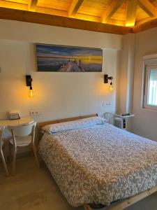 Postel nebo postele na pokoji v ubytování APARTAMENTOS SAN JUAN de GAZTELUGATXE