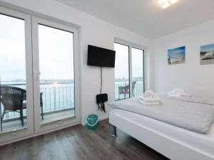 Postel nebo postele na pokoji v ubytování Holiday apartment in Olpenitz with sauna