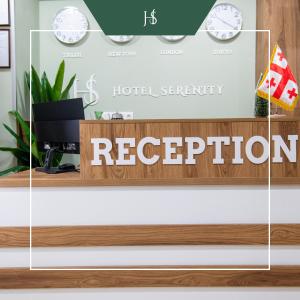 a reception desk with the hotel security registration sign on it at Hotel Serenity in Tbilisi City