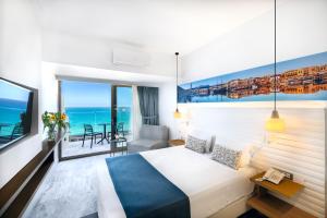 Ένα ή περισσότερα κρεβάτια σε δωμάτιο στο Archipelagos Hotel +57 φωτογραφίες