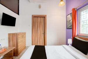 Postel nebo postele na pokoji v ubytování Hotel O Cosmopolis Bhubaneswar Formerly Luxury Stay + 19 fotografií