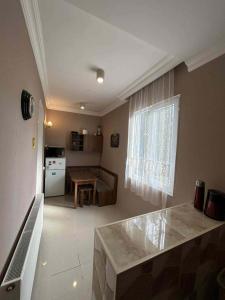 a kitchen and living room with a counter and a table at Apartment 9 in Mtskheta