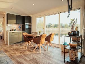 Kuchyň nebo kuchyňský kout v ubytování Gräbendorfer See Resort