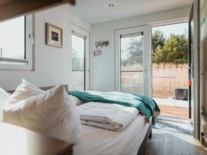 Postel nebo postele na pokoji v ubytování Gräbendorfer See Resort