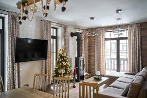 TV a/nebo společenská místnost v ubytování Finlandia Chalet