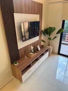 a mirror on a wall in a living room at Iguazu Lofts in Puerto Iguazú