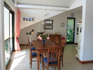 a dining room with a wooden table and chairs at One-bedroom apartment in Sassnitz