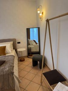 Un pat sau paturi într-o cameră la Belloro