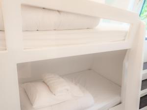 a white refrigerator filled with lots of white towels at Owl - Uk43447 in Hayle +5 photos