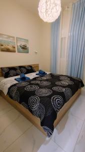 Postel nebo postele na pokoji v ubytování Sunrise Apartment + 22 fotografií