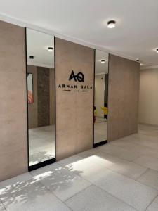 a room with a glass door with a sign on it at ЖК Арман кала 1- комнатная квартира in Zhezdi +4 photos