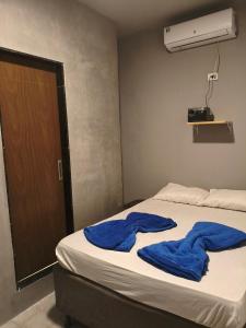 Ένα ή περισσότερα κρεβάτια σε δωμάτιο στο Suíte Encantos do Natal