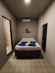 Ένα ή περισσότερα κρεβάτια σε δωμάτιο στο Suíte Encantos do Natal