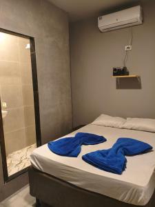 Ένα ή περισσότερα κρεβάτια σε δωμάτιο στο Suíte Encantos do Natal +1 φωτογραφίες