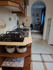 a kitchen with a stove and a counter top at Central Modern Studio - wifi, coffee in Bratislava +1 photo
