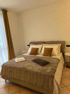 Un pat sau paturi într-o cameră la Belloro