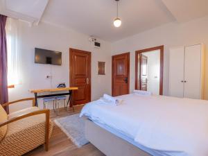 a bedroom with a bed and a table and a desk at Oldsophia hotels in Istanbul